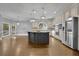 Bright kitchen with island, stainless appliances, and lots of cabinet space at 8935 Muirfield Ct, Duluth, GA 30097