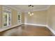 Cozy living room featuring hardwood floors, neutral walls, and natural light at 8935 Muirfield Ct, Duluth, GA 30097