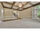 Bright living room featuring a coffered ceiling, hardwood floors and access to the staircase at 8935 Muirfield Ct, Duluth, GA 30097