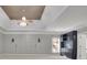 A large room showcasing ceiling fans and unique wall paneling details at 8935 Muirfield Ct, Duluth, GA 30097