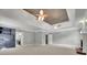 Spacious living room with dual ceiling fans, built-in shelving, and fireplace at 8935 Muirfield Ct, Duluth, GA 30097