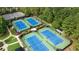 Aerial view of tennis courts surrounded by trees in a neighborhood at 8935 Muirfield Ct, Duluth, GA 30097