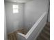 Bright two-story entryway with wood flooring and staircase to the upper level at 250 Shawnee Trl, Dallas, GA 30157