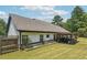Back exterior view with patio, outdoor kitchen and dining area at 1369 Sierra Ridge Pl, Loganville, GA 30052