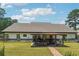 Home showcasing a cozy outdoor kitchen and dining area on a covered patio at 1369 Sierra Ridge Pl, Loganville, GA 30052