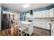 Kitchen showcasing an island, stainless steel appliances, and a tile backsplash at 1369 Sierra Ridge Pl, Loganville, GA 30052