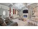 A comfy living room includes sofas, a fireplace, and stylish decor at 1369 Sierra Ridge Pl, Loganville, GA 30052