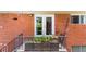 Cozy balcony with seating, greenery and red brick building at 1822 N Rock Springs Ne Rd # 24, Atlanta, GA 30324