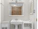 Bathroom with a pedestal sink, framed mirror, and tiled shower at 1822 N Rock Springs Ne Rd # 24, Atlanta, GA 30324