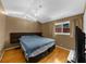 Bedroom with a large window, hardwood floors, and stylish decor at 1822 N Rock Springs Ne Rd # 24, Atlanta, GA 30324