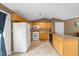 Bright kitchen featuring tile floors, light wood cabinetry, and modern appliances with a convenient serving counter at 1822 N Rock Springs Ne Rd # 24, Atlanta, GA 30324