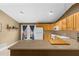 Bright kitchen featuring wood cabinets, appliances, and a breakfast bar, creating a functional and stylish cooking space at 1822 N Rock Springs Ne Rd # 24, Atlanta, GA 30324