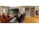 Cozy living room featuring hardwood floors, a large window, and comfortable leather seating at 1822 N Rock Springs Ne Rd # 24, Atlanta, GA 30324