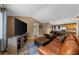 Cozy living room with hardwood floors, a comfortable sofa, and a TV, creating a perfect place to relax and unwind at 1822 N Rock Springs Ne Rd # 24, Atlanta, GA 30324