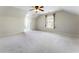 Upstairs bonus room with ceiling fan, a window for natural light and neutral carpet at 183 Applewood Ln, Acworth, GA 30101