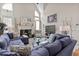 Cozy living room with large sectional sofa, fireplace, and neutral decor, perfect for relaxing at 50 Cannonade Ct, Covington, GA 30016