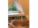 Bright bathroom featuring a large bathtub under a window, offering natural light and views of the lush greenery outside at 5015 Wright Bridge Rd, Cumming, GA 30028
