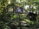 Unique dome-shaped home nestled among lush trees, blending seamlessly with its natural surroundings at 5015 Wright Bridge Rd, Cumming, GA 30028
