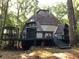 Unique dome home with a spacious deck, surrounded by lush trees, offering a private and serene outdoor living experience at 5015 Wright Bridge Rd, Cumming, GA 30028