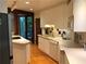 Modern white kitchen with a sleek design, ample counter space, and stainless steel appliances at 5015 Wright Bridge Rd, Cumming, GA 30028