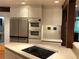 Spacious kitchen featuring a cooktop island and stainless steel appliances at 5015 Wright Bridge Rd, Cumming, GA 30028