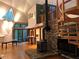 Inviting living room with a cozy fireplace, unique stone accents, and a spiral staircase, adding a touch of elegance at 5015 Wright Bridge Rd, Cumming, GA 30028