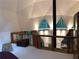 Stylish loft features unique ceilings, triangular windows, and open railing at 5015 Wright Bridge Rd, Cumming, GA 30028