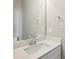Bathroom featuring modern sink and quartz countertops, with neutral paint at 1095 Tucker Ave # 401, Atlanta, GA 30310
