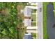 Backyard features a fire pit, beautiful landscaping, bordering a pond, offering tranquil views at 236 Creek View Ln, Acworth, GA 30102