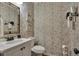 Well-appointed powder room features decorative wallpaper, a modern sink, and stylish fixtures at 236 Creek View Ln, Acworth, GA 30102
