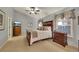 Comfortable primary bedroom with a ceiling fan, two dressers, and plush bedding at 236 Creek View Ln, Acworth, GA 30102