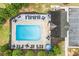 Aerial view of community pool featuring lounge seating, umbrellas, and a well-maintained pool area at 236 Creek View Ln, Acworth, GA 30102