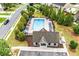 Community pool area featuring ample lounge seating, a clubhouse, and meticulously kept grounds at 236 Creek View Ln, Acworth, GA 30102