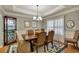 Traditional dining room featuring a chandelier, decorative rug, and glass display case at 236 Creek View Ln, Acworth, GA 30102