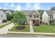 Charming two-story home with a well-kept lawn and inviting walkway under a blue sky at 236 Creek View Ln, Acworth, GA 30102