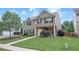 Attractive two-story home with a well-maintained lawn, complemented by lush landscaping at 236 Creek View Ln, Acworth, GA 30102