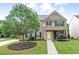 Charming two-story home with a well-manicured lawn, stone accents, and inviting front porch at 236 Creek View Ln, Acworth, GA 30102