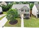 Aerial front view of the beautiful home with well-manicured lawn, large tree, and neutral colors at 236 Creek View Ln, Acworth, GA 30102
