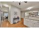 Open concept kitchen with granite countertops and hardwood floors, leading to dining and living areas at 236 Creek View Ln, Acworth, GA 30102