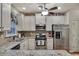 Well-equipped kitchen with stainless steel appliances, granite countertops, and tile backsplash at 236 Creek View Ln, Acworth, GA 30102