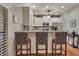 Open kitchen with bar seating, granite countertops and hardwood floors at 236 Creek View Ln, Acworth, GA 30102