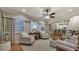 Bright living room with large windows, stylish curtains, and an open floor plan to the kitchen at 236 Creek View Ln, Acworth, GA 30102