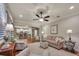Inviting living area open to the kitchen, featuring a ceiling fan, neutral décor, and ample seating at 236 Creek View Ln, Acworth, GA 30102