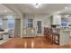 Open-concept living space featuring a kitchen with bar seating and hardwood floors at 236 Creek View Ln, Acworth, GA 30102