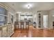 Bright living space featuring an open kitchen, bar seating, hardwood floors and a serving hutch at 236 Creek View Ln, Acworth, GA 30102