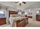 Comfortable main bedroom with a decorative bedspread, ceiling fan, and neutral-toned walls at 236 Creek View Ln, Acworth, GA 30102