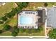 Aerial view of a community pool with seating, lounge chairs, and a pool house at 236 Creek View Ln, Acworth, GA 30102