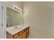 Bathroom with a vanity with a mirror and lights, a sink, and a shower at 2421 Fall Creek Lndg, Loganville, GA 30052