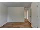 An airy bedroom featuring wood-look flooring and fresh white walls at 2421 Fall Creek Lndg, Loganville, GA 30052