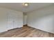 This bedroom offers wood flooring and a closet for storage at 2421 Fall Creek Lndg, Loganville, GA 30052